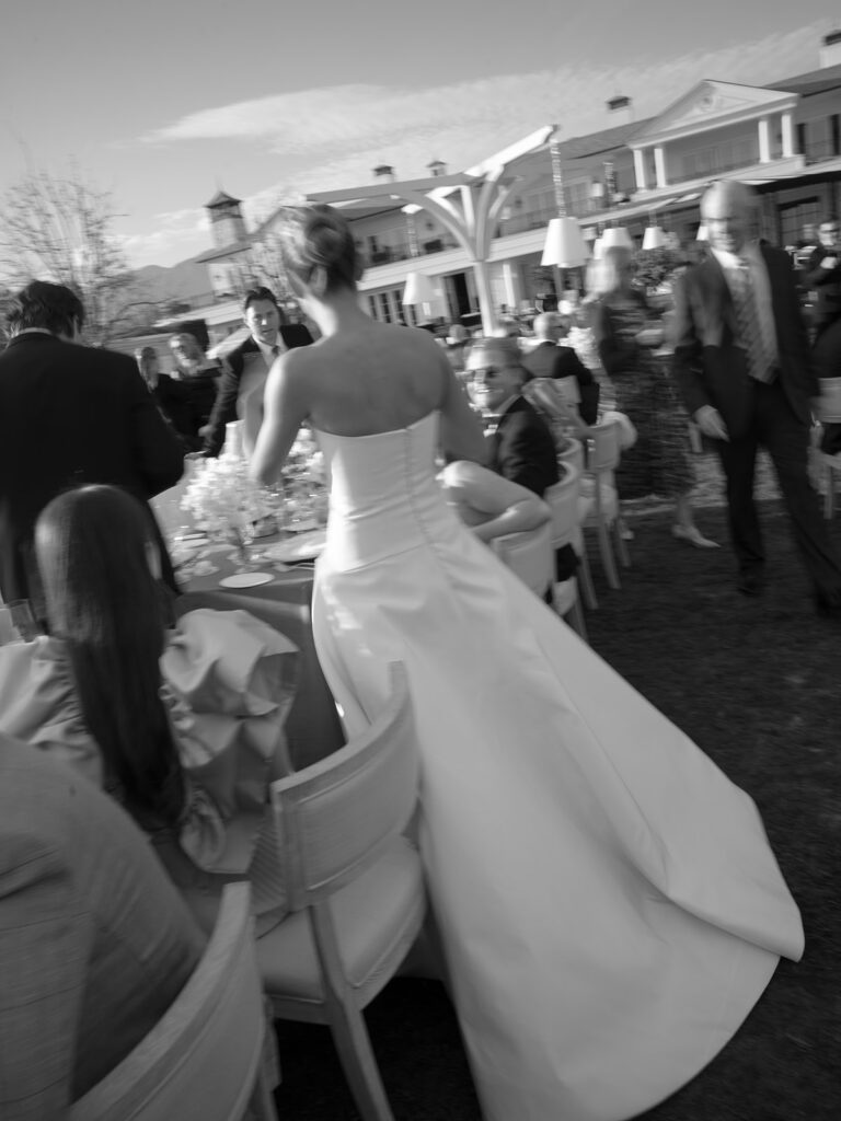 Bride walking through the Grand Lawn reception at Rosewood Miramar